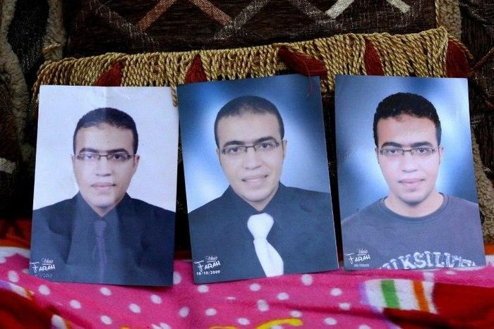 Portraits of Abdallah El-Hamahmy, an Egyptian suspected of being the machete attacker in Paris's Louvre museum, placed on a sofa at the family home in the Nile delta city of Mansura, some 120 kms north of Cairo