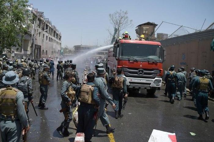 Hundreds of demonstrators calling for President Ashraf Ghani to step down and chanting "Death to the Taliban" clashed with police near the bombing site, prompting officials to respond with live rounds, tear gas and water cannon