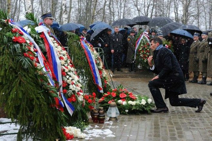 Grieving relatives of the victims of the April 2010 crash of a Polish presidential jet in which president Lech Kaczynski and all 95 other passengers were killed attend a mass during a memorial service at the site of the disaster April 9, 2011