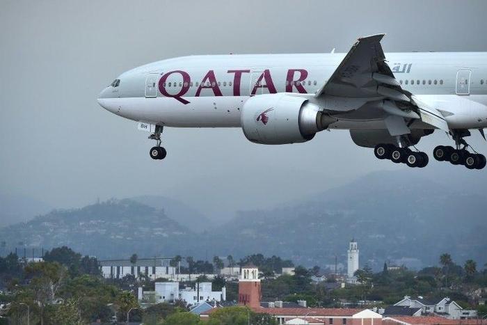 A Qatar Airways plane lands at Los Angeles International Airport