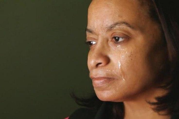 This crying woman needs help urgently