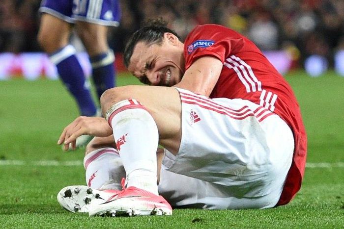 Zlatan Ibrahimovic reacts after injuring his knee during their UEFA Europa League quarter-final second leg football match against Anderlecht at Old Trafford in Manchester, on April 20, 2017