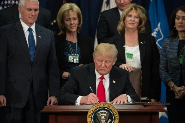 US President Donald Trump ordered work to begin on planning and building a wall on the Mexican border, saying "a nation without borders is not a nation"