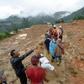 Rescue workers search for survivors at the site of a landslide triggered by heavy rain, in Sukabumi, Indonesia's West Java province, on January 1, 2019