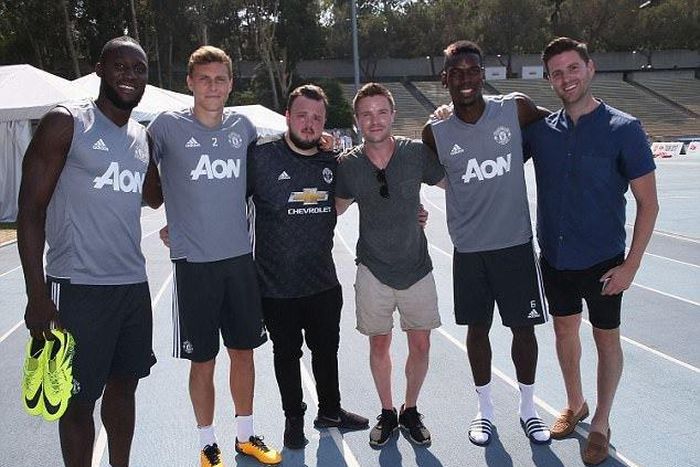 John Bradley-West and Joe Dempsie with Paul Pogba and Manchester United players