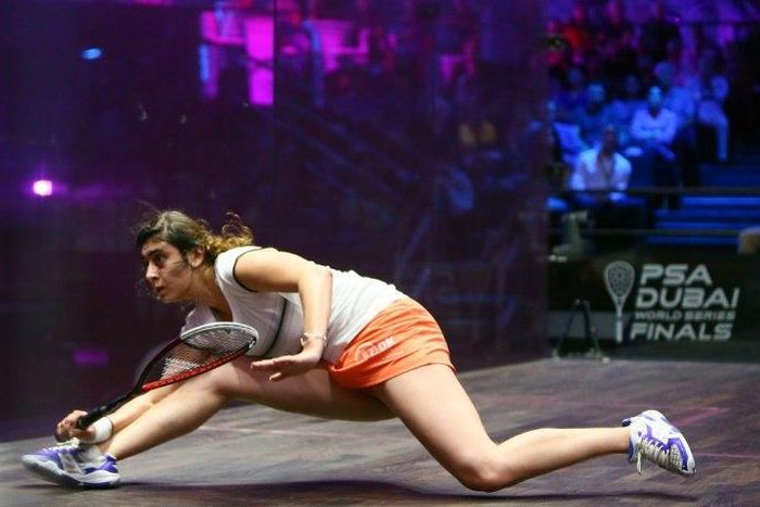 Nour El Sherbini of Egypt tries to return a shot to Laura Massaro of Great Britian during their semi-final match of the Dubai PSA World Series Finals squash tournament in Dubai on May 27, 2016