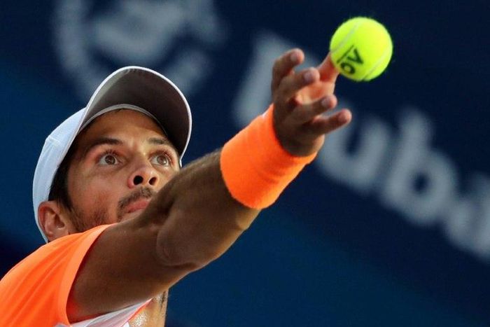Fernando Verdasco serves against Robin Haase in the semi-finals of the Dubai Tennis Championships on March 3, 2017.