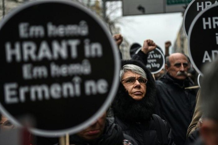 Crowds in Istanbul hold placards reading 'We all are Hrant, we all are Armenians" on January 19, 2017, to mark the 10th anniversary of the killing of Turkish-Armenian journalist Hrant Dink