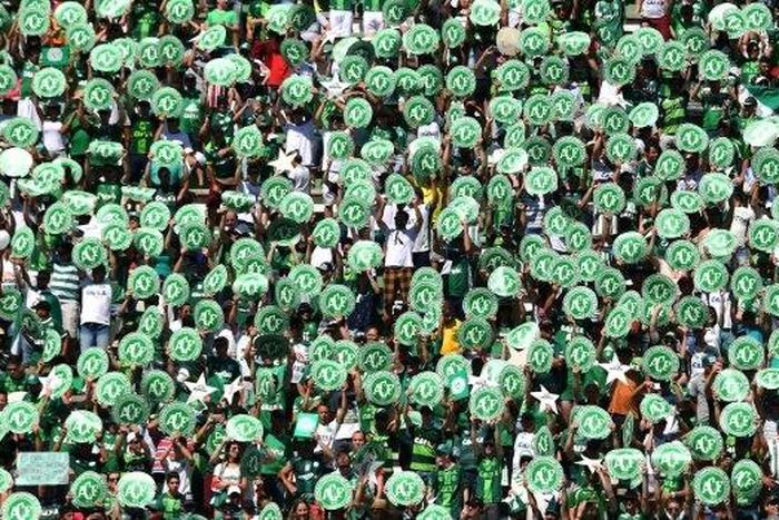 Chapecoense's supporters cheer before a friendly football match against Palmeiras -Brazilian Champion 2016- at the Arena Conda stadium in Chapeco, Santa Catarina state, in southern Brazil on January 21, 2017