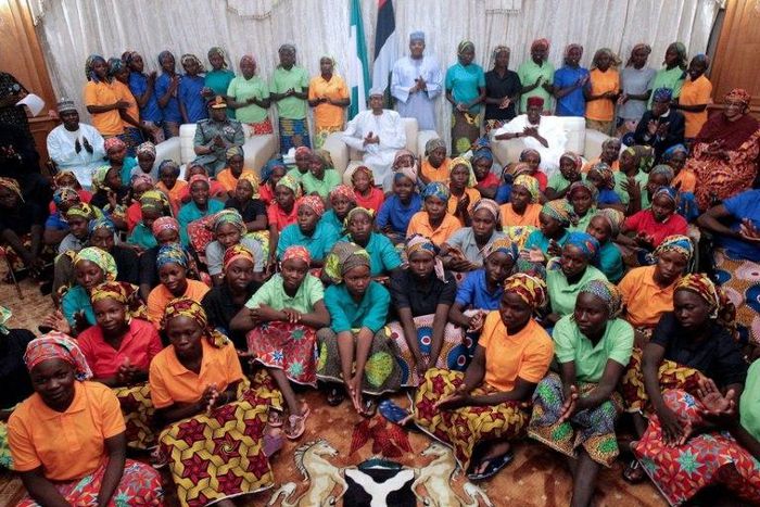 Nigeria's President Muhammadu Buhari, seen sitting among the 82 Chibok girls rescued from Boko Haram after a prisoner swap, was elected on as promise to to defeat the insurgents