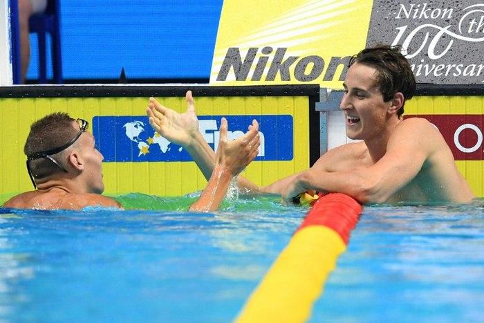 Australia's Cameron McEvoy (R) talks to USA's Caeleb Dressel after competing in a 100m freestyle semi-final during the 2017 FINA World Championships in Budapest, on July 26