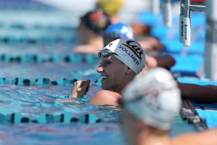 Dana Vollmer reacts after competing in the preliminary heat of the women's 50 meter freestyle on day two of the Arena Pro Swim Series in Mesa, Arizona