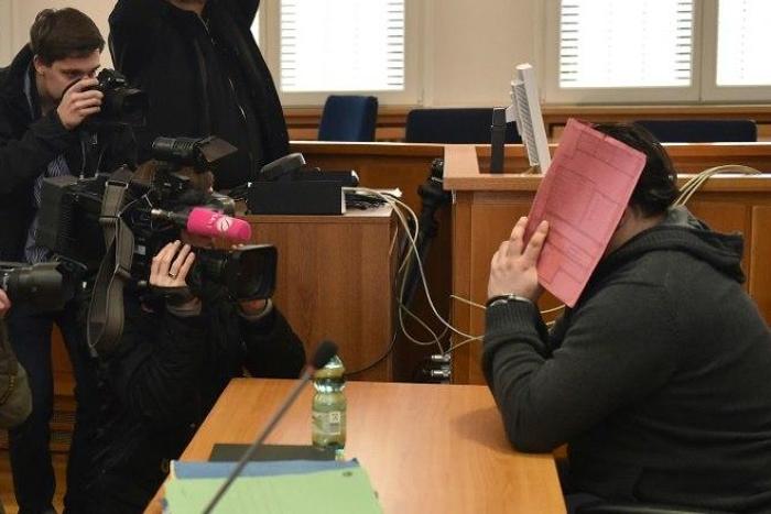 Niels Hoegel, seen hiding his face during his trial, was jailed for life in 2015 after admitting killing several patients at a hospital in northern Gemrany