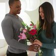 Man giving his girlfriend flowers