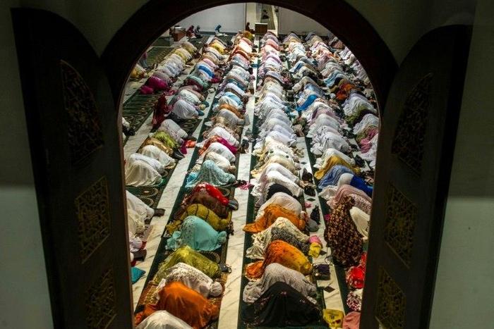 Indonesian Muslims pray during the start of the holy month of Ramadan. More than 1.5 billion Muslims around the world will mark the month, during which believers abstain from eating, drinking, and smoking from dawn until sunset