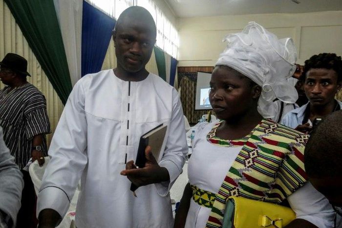Evangelical preacher Emmanuel Momoh, seen attending an auction in Freetown with his wife, says the massive diamond he uncovered is worth $50 million, seven times the top bid, prompting the government to seek higher offers in Belgium