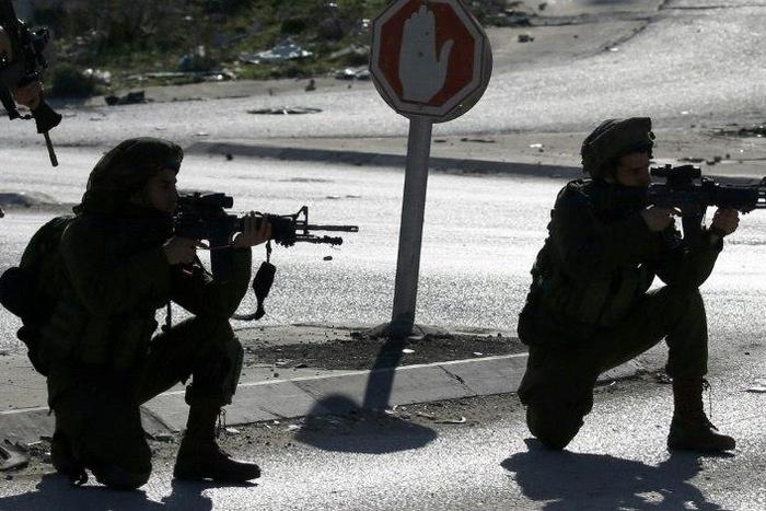 Israeli soldiers and Palestinian stone throwers clash east of Nablus, in the occupied West Bank