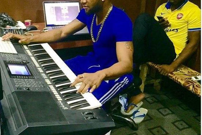 Kcee and Harry song in the studio.