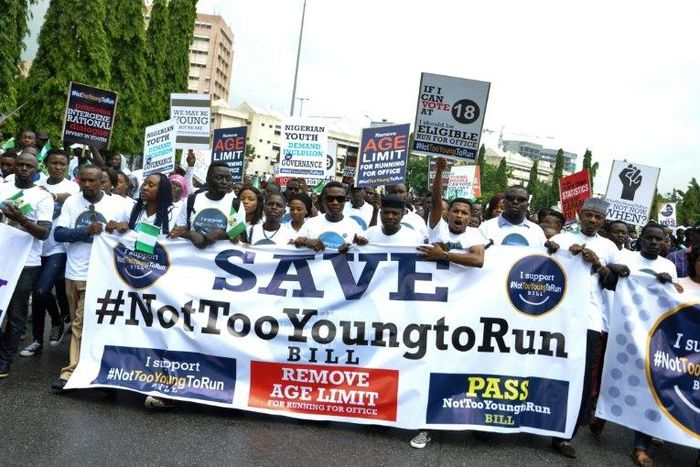 About 500 protesters in Nigeria, wearing white T-shirts and brandishing placards proclaiming "#NotTooYoungToRun", marched two kilometres to the National Assembly