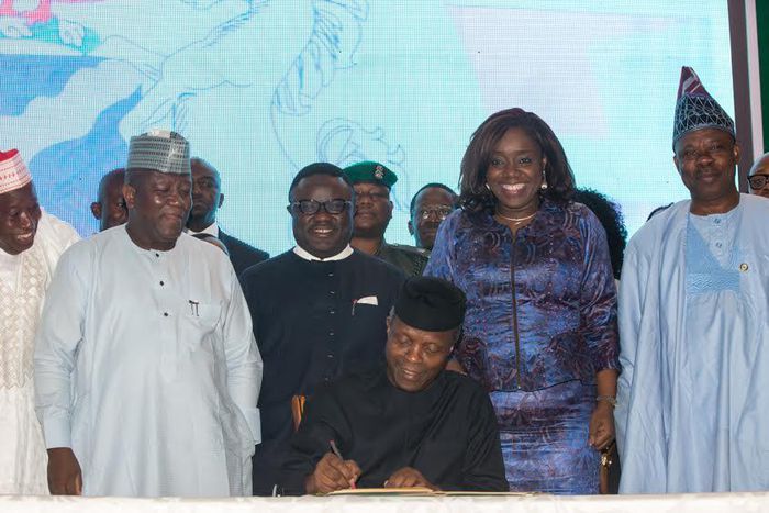 Acting President Yemi Osinbajo signing the executive order on Voluntary Assets and Income Declaration Scheme (VAIDS) at the State House Conference Centre, Abuja on Thursday, June 29, 2017