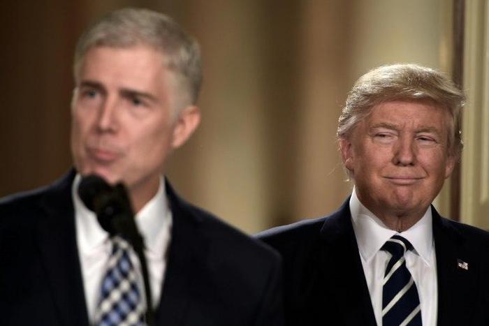 Judge Neil Gorsuch (L) speaks, after US President Donald Trump nominated him for the Supreme Court, at the White House on January 31, 2017