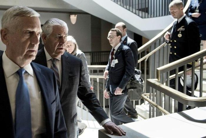 US Defense Secretary James Mattis, left, and Secretary of State Rex Tillerson, second left, are weighing whether to have Congress replace existing authorization for the use of military force against extremists