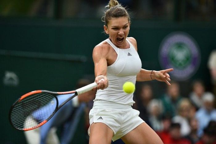 Romania's Simona Halep returns against Britain's Johanna Konta at the 2017 Wimbledon Championships in London, on July 11, 2017.