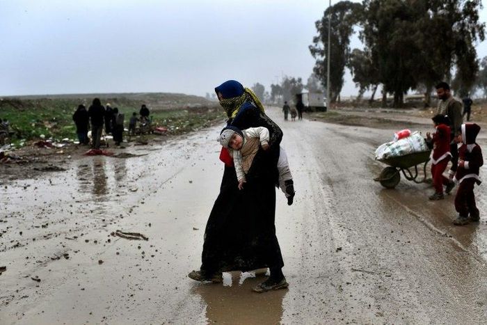 An Iraqi woman return to an area of west Mosul liberated from the Islamic State group
