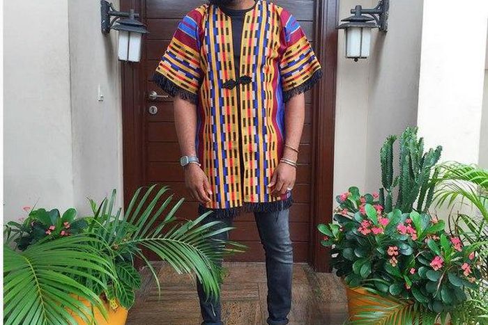 Noble Igwe gives a pop of colour to his outfit with a tribal kimono