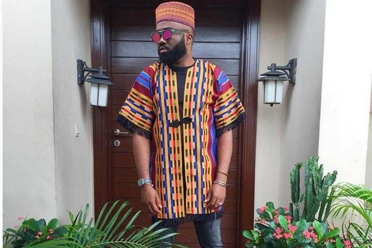 Noble Igwe gives a pop of colour to his outfit with a tribal kimono