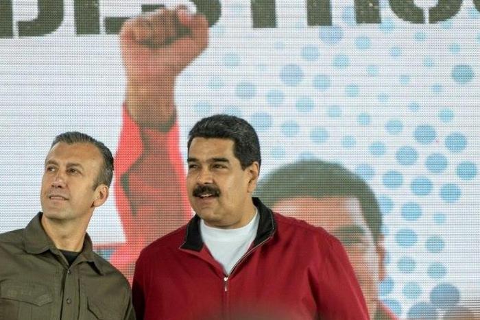 Venezuelan President Nicolas Maduro (right) and his Vice-President Tareck El Aissami participate in a Caracas rally on January 31, 2017