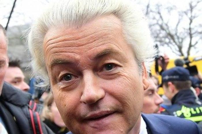 Dutch far-right politician and leader of the Partij Voor De Vrijheid (PVV or Freedom Party) Geert Wilders is surrounded by security and supporters as he officially launches his parliamentary election campaign in Spijkenisse on February 18, 2017. Firebr...