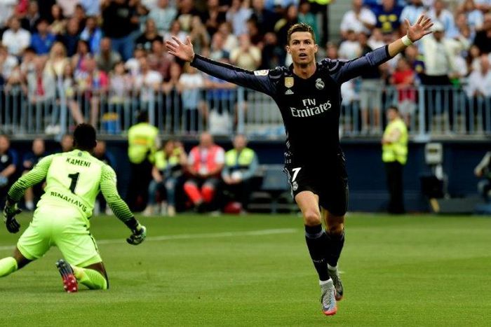 Real Madrid's forward Cristiano Ronaldo celebrates after scoring against Malaga on May 21, 2017