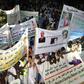 This photo taken on July 20, 2017 shows supporters of Mauritanian President gathering and holding banners during a rally ahead of the constitutional referendum on scrapping the senate and changing the national flag, in Nouakchott