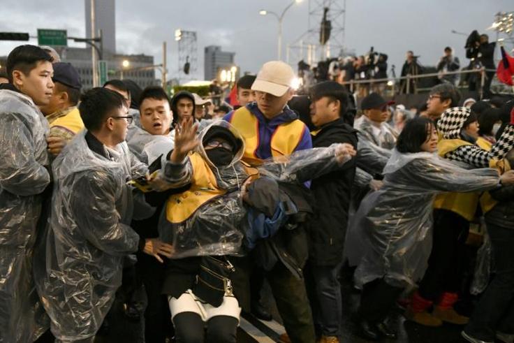 Taiwanese "yellow vest" protesters interrupted a New Year's Day ceremony