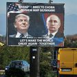A billboard showing US President-elect Donald Trump and Russian President Vladimir Putin is seen in Montenegro