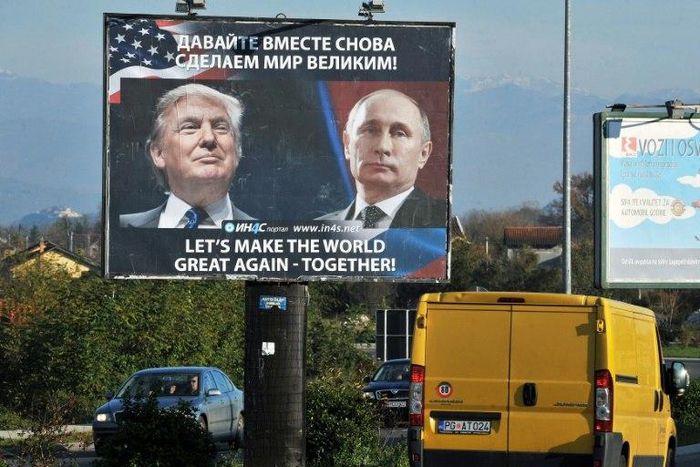 A billboard showing US President-elect Donald Trump and Russian President Vladimir Putin is seen in Montenegro