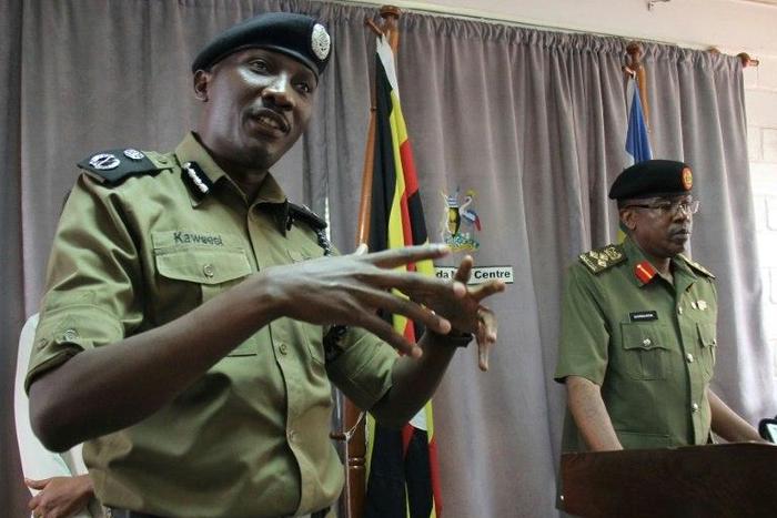 Ugandan police spokesman Andrew Kaweesi (Left) was shot and killed as he left his home in Kampala