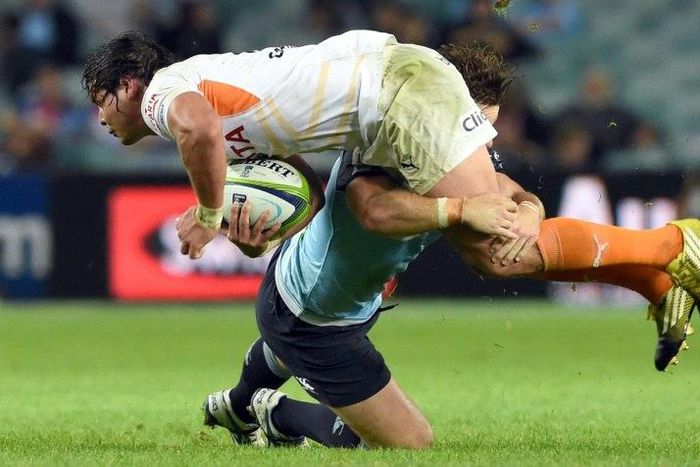 Central Cheetahs player Francois Venter is tackled during a Super Rugby match against the NSW Waratahs in Sydney in May 2016