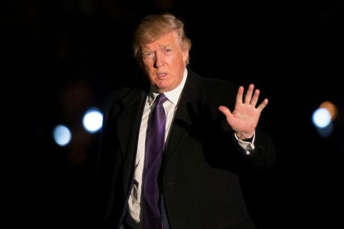 US President Donald Trump walks from Marine One on the South Lawn of the White House as he returns from his weekend trip to Mar-a-Lago