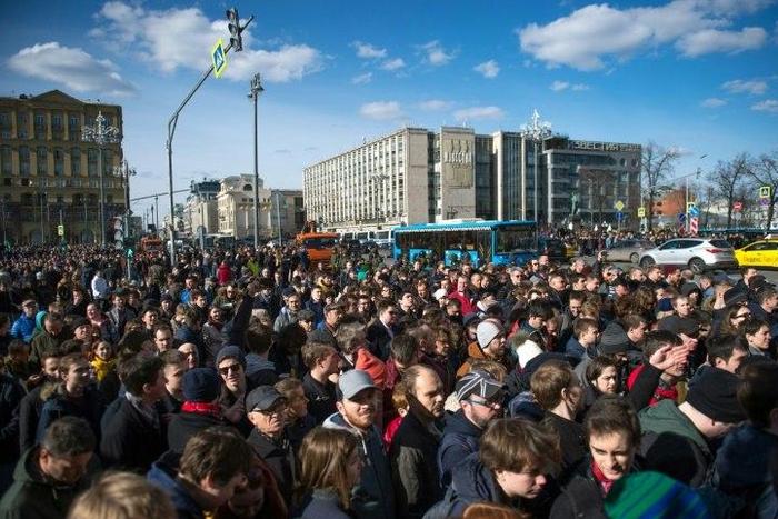 This photo taken on March 26, 2017 shows opposition supporters taking part in an unauthorised anti-corruption rally in central Moscow