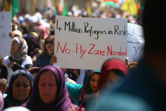 Kurdish protesters demand a no-fly zone in northern Syria on April 26, 2017, a day after after deadly Turkish air strikes