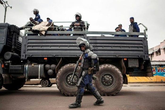 Congolese policemen patrol the streets of the capital Kinshasa