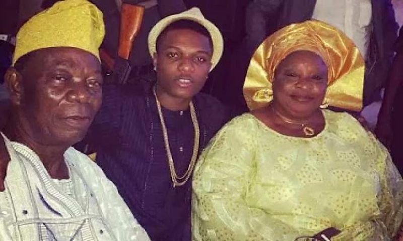 Wizkid and his parents.