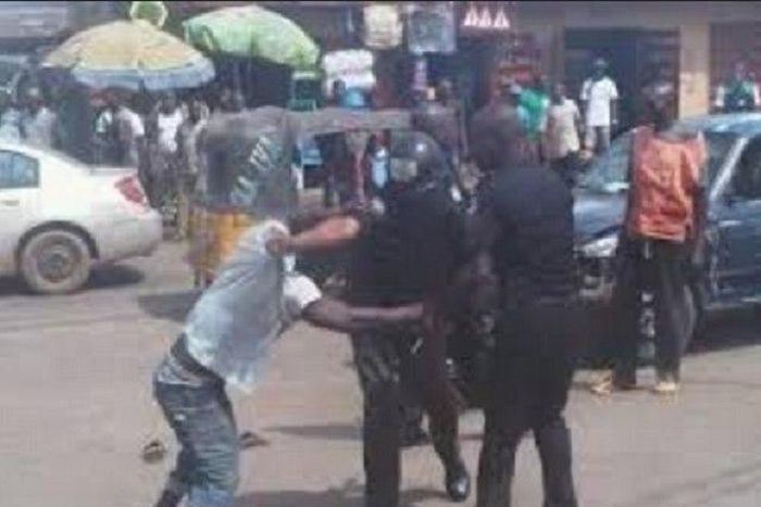 A man fighting with police officers (Illustration)