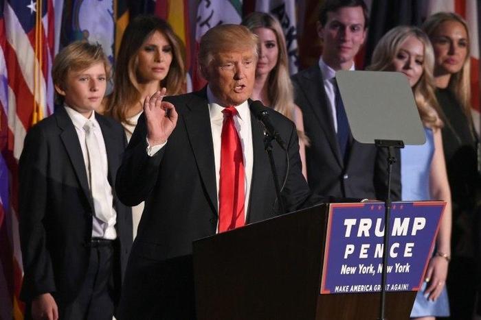 Republican presidential nominee Donald Trump arrives on stage with his family to speak to supporters during election night in New York on November 9, 2016