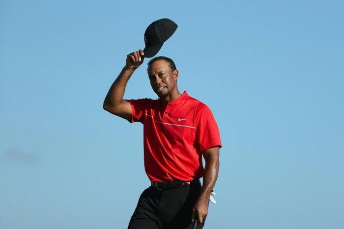Tiger Woods of the United States tips his cap on the 18th hole during the final round of the Hero World Challenge