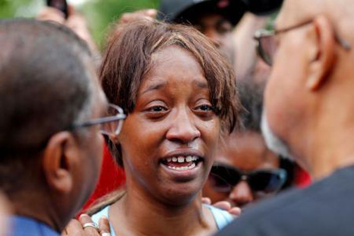 Diamond Reynolds weeps after she recounts the incidents that led to the fatal shooting of her boyfriend Philando Castile by Minneapolis area police during a traffic stop on Wednesday, at a "Black Lives Matter" demonstration in front of the Governor"s M...