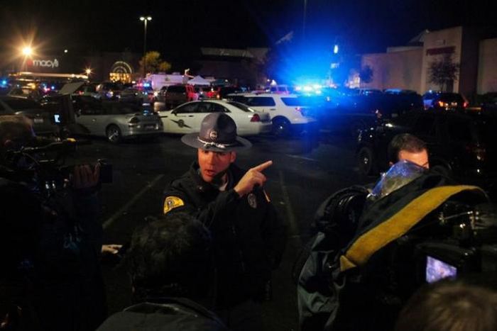 Washington State Trooper Mark Francis speaks to the media at the Cascade Mall following reports of an active shooter in Burlington, Washington. 
