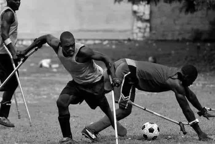 People living with disability playing football. 